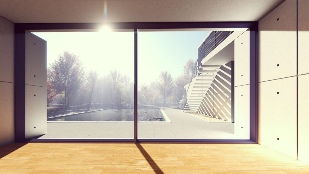 Grande baie vitrée dans une maison avec vue sur la piscine